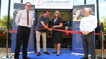 Image of the ribbon cutting ceremony for warehouse opening